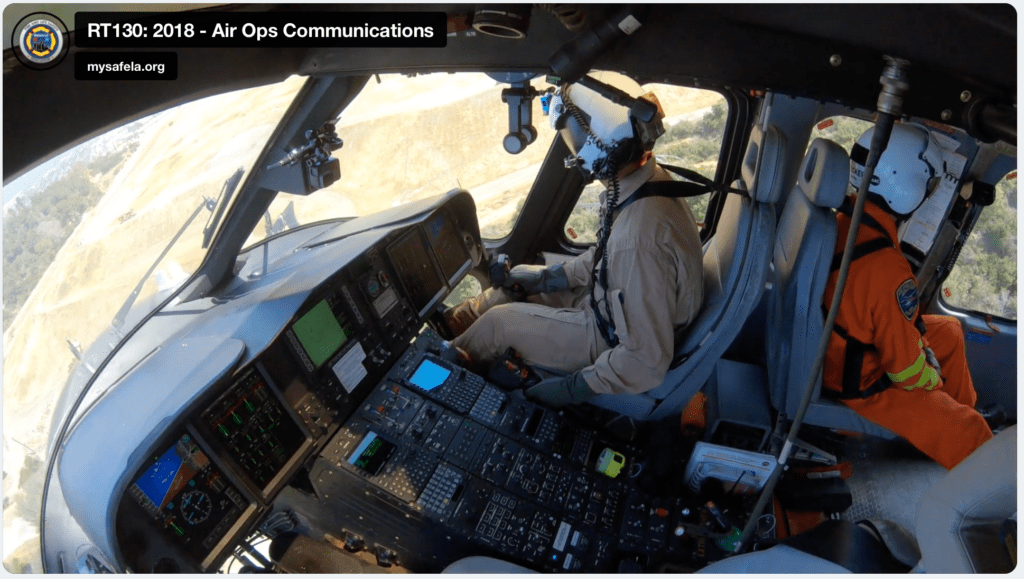 Screenshot of a video showing two pilots operating an aircraft.